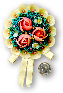 A floral brooch made from seashells